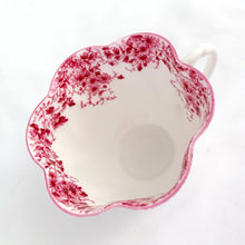 Load image into Gallery viewer, Absolutely stunning vintage bone china &quot;Dainty Pink&quot; tea cup and saucer. Produced by Shelley in England between 1938.  In excellent vintage condition, free from chips/cracks/crazing. Appears to be unused.  Tea cup measures 3-3-8&quot; x 2-1/4&quot; | marked &quot;051/P&quot;  Saucer measures 5-1/2&quot; | marked &quot;051/P&quot;
