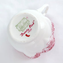 Load image into Gallery viewer, Absolutely stunning vintage bone china &quot;Dainty Pink&quot; tea cup and saucer. Produced by Shelley in England between 1938.  In excellent vintage condition, free from chips/cracks/crazing. Appears to be unused.  Tea cup measures 3-3-8&quot; x 2-1/4&quot; | marked &quot;051/P&quot;  Saucer measures 5-1/2&quot; | marked &quot;051/P&quot;

