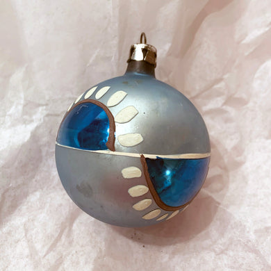 Vintage hand blown pale blue glass ball Christmas tree ornament with great patina and hand painted with blue, gold and white graphic design. Marked Poland.  In vintage condition.  Measures 2