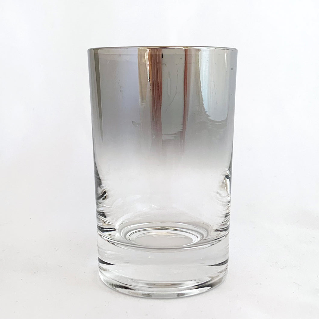 Mid-century vintage silver fade highball glasses are perfect for any occasion! These are decorated with a silver top that fades down to clear glass. These will certainly add some vintage glamour to your bar cart! Produced by Vitreon Queen's Lustreware.   All six glass are in excellent condition, no chips or cracks.  Size: 2-1/4