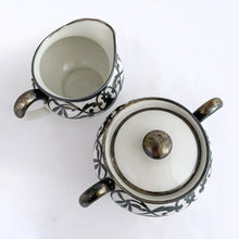 Load image into Gallery viewer, Vintage white porcelain with silver overlay creamer and covered sugar bowl in the art nouveau style. Produced by Limoges Bernardaud (B&amp;Co) France, circa 1940.  In excellent condition, free from chips/cracks/repairs.  Sugar measures 4&quot; x 3-1/2&quot; and the creamer measures 3-1/2&quot; x 3&quot; (not incl. handles)
