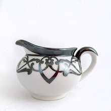 Load image into Gallery viewer, Vintage white porcelain with silver overlay creamer and covered sugar bowl in the art nouveau style. Produced by Limoges Bernardaud (B&amp;Co) France, circa 1940.  In excellent condition, free from chips/cracks/repairs.  Sugar measures 4&quot; x 3-1/2&quot; and the creamer measures 3-1/2&quot; x 3&quot; (not incl. handles)
