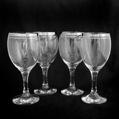 Mid-century vintage silver rimmed wine glasses with a silver are perfect for any occasion!  Decorated with a silver rim and band below. These will certainly add some vintage glamour to your bar cart!   In excellent condition, no chips or cracks.  Size: 3