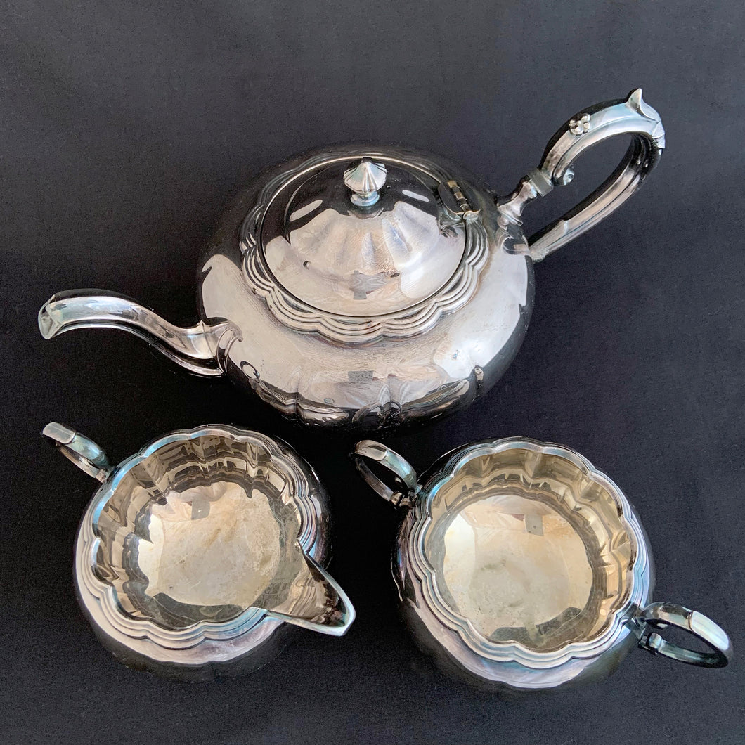 This beautifully crafted Birks Canada Primrose Plate silver plated teapot with matching creamer and sugar. Perfect for hosting an afternoon tea party!  Marked 
