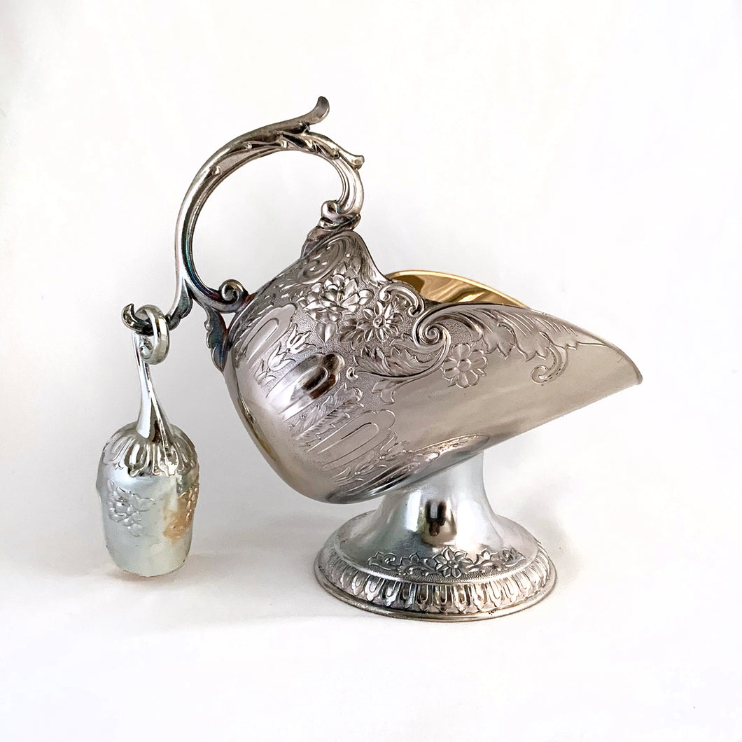 This vintage silver plated sugar scuttle and scoop set, embossed with roses, flowers, leaves and scroll details No 540. It's just a beautiful vessel for sugar cubes or bath salts. Produced by Leonard Manufacturing Ltd. in Japan.  In good vintage condition. In original box.  Measures approx. 6-1/4