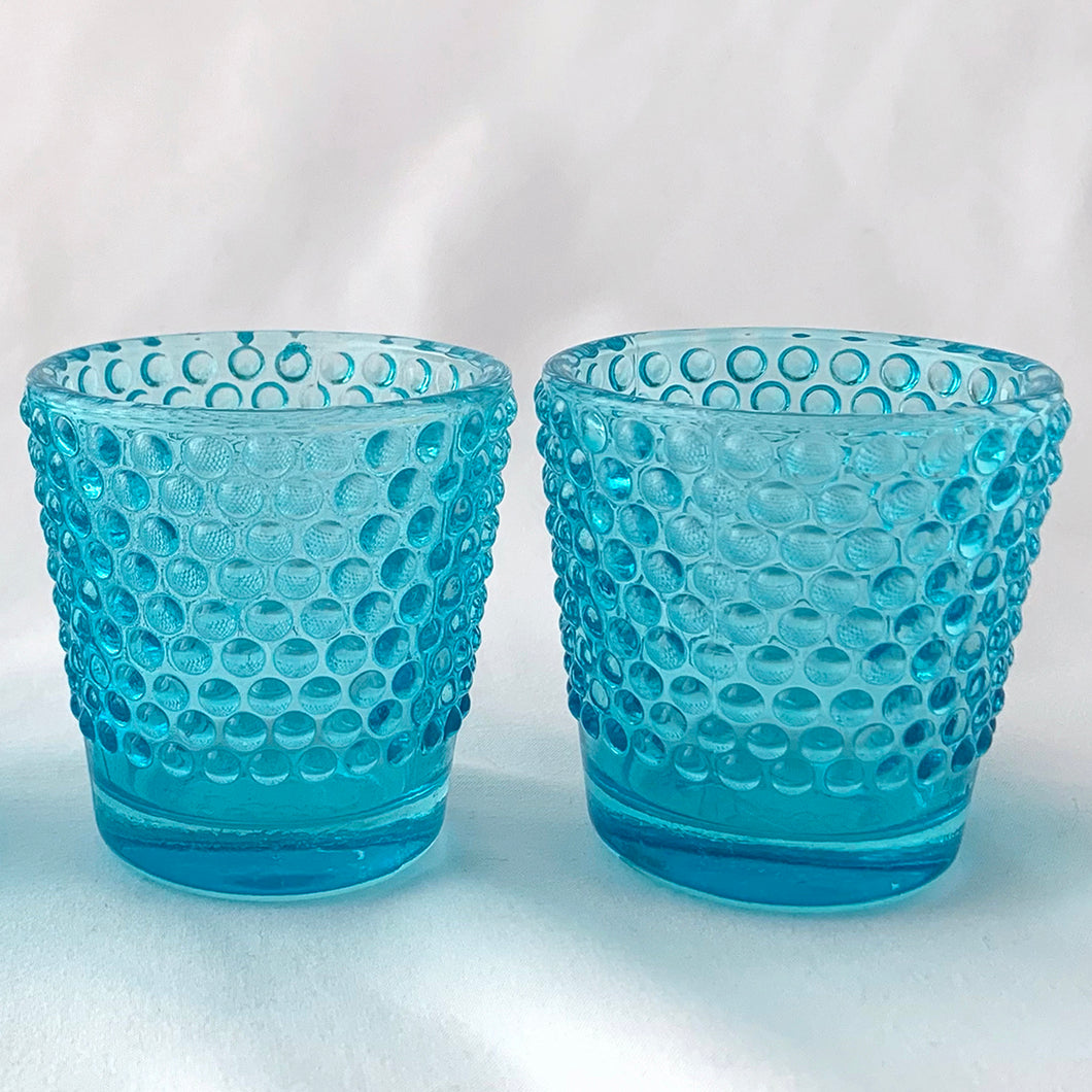 This pair of vintage votive candle holders are just adorable with their bubble design. Get groovy baby as the candle light glows through bubbles. Includes tealight candles.  In excellent condition, no chips or cracks.  Measures 2-3/8