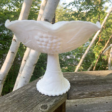 Load image into Gallery viewer, Beautifully detailed vintage milk glass pedestal fruit bowl with embossed grape and leaf pattern, shape #901. Perfect to use as a intended, as a catchall or interior decor. Produced by L.E. Smith Glass, produced between 1956 - 1968.  In excellent condition, free from chips/cracks/repairs.  Dimensions: 8-1/8&quot; x 10-13/4&quot;
