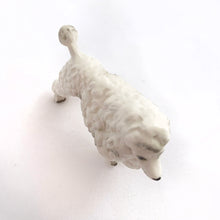 Load image into Gallery viewer, Sweet miniature porcelain figurine of a standing white poodle with hand painted details.  In excellent condition, no chips or cracks.  Measures approximately 1&quot; x 2-5/8&quot; x 2-1/8&quot; tall

