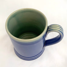 Load image into Gallery viewer, This vintage style mug is glazed in blue with a watery blue/green interior and a ribbed handle. Hand crafted by Thomas Aitken of AitkenHyde, Canada.  In excellent condition.  Measures 3 1/8 x 4 inches
