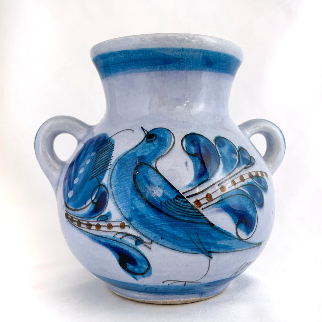 Vintage Tonala Pottery two handled vase with a beautifully hand painted bluebird on one side and a butterfly and foliage on the reverse. Signed 