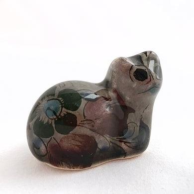 Beautiful Mexican Tonala miniature folk art pottery rooster bird figurine. This hand painted figurine is gray with a nicely detailed face in black and brown with the body in pink, black and green florals. Signed 