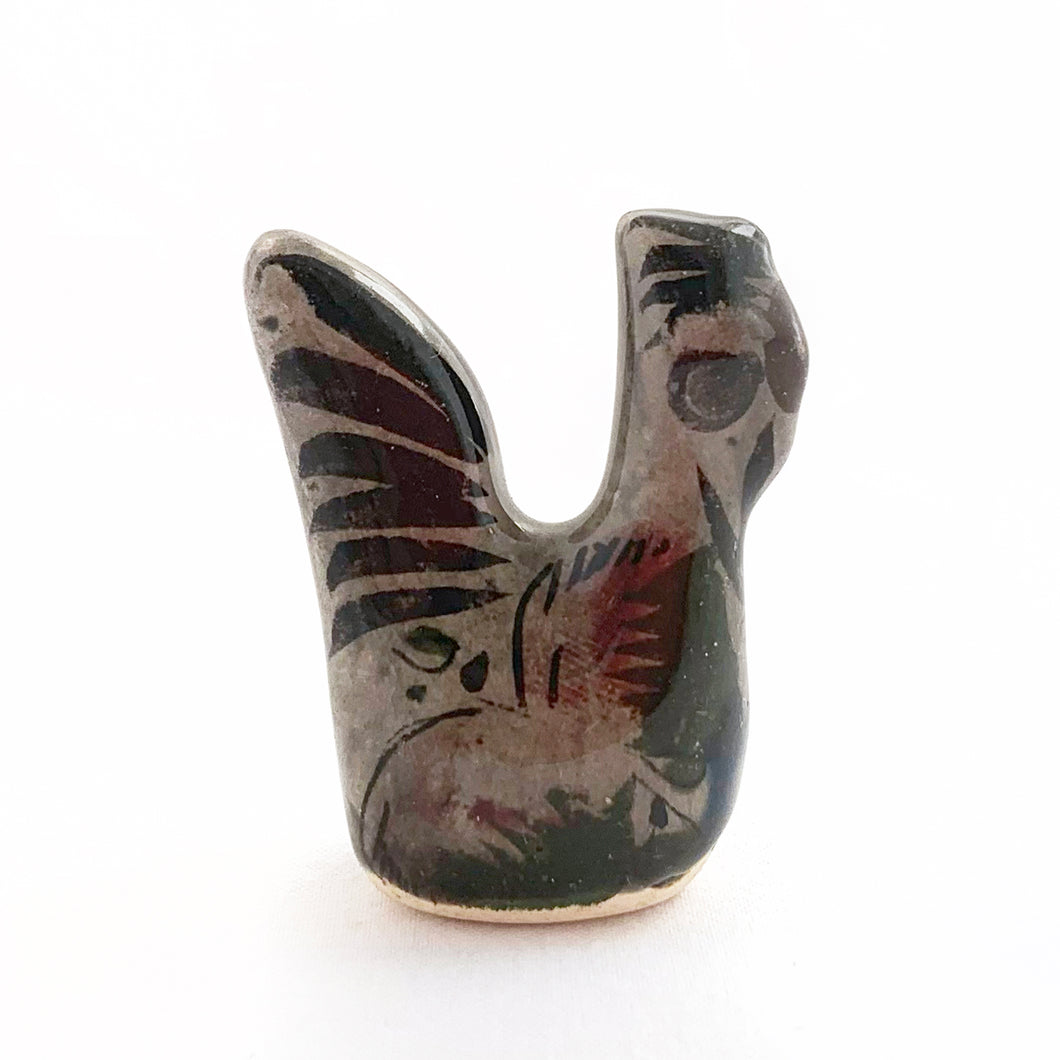 Beautiful Mexican Tonala miniature folk art pottery rooster bird figurine. This hand painted figurine is gray with a nicely detailed face in black and brown with the body in pink, black and green florals. Signed 