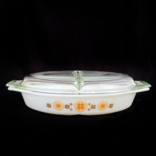 Load image into Gallery viewer, Vintage &quot;Town and Country&quot; divided casserole lidded baking/serving dish in the colours of brown and orange starbursts on white. Possibly designed by Philip Johnson for PYREX. Produced by Corning Glass Works, USA,  1963-1967. The perfect cooking and storage solution!  In excellent condition, free from chips/cracks. Colours are vibrant.  Casserole measures 12 1/2 x 8 1/2 x 2 inches  Lid 12 3/4 x 8 3/8 x 1 7/8 inches
