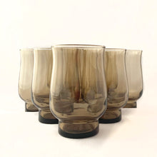 Load image into Gallery viewer, Vintage set of eight stackable &quot;Tulip Tawny (All Brown)&quot; flat juice glass tumblers. Produced by Libbey Glass Company, circa 1970s.  In excellent condition, no chips or cracks.  Measures 2-3/4&quot; x 4-1/4&quot;, holds 8oz
