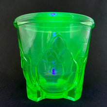 Load image into Gallery viewer, Antique vintage green uranium/vaseline depression era glass footed 2 cup hand beater mixer. The glass cup glows beautifully under black light, has an artichoke design on all 4 sides, measuring lines in 1/4 cup increments and four square feet. Bottom is marked &quot;Patent Applied For&quot;. Produced by Hazel-Atlas Glass, circa 1920.  In overall excellent condition, free from chips/cracks. The metal beater has wear commensurate with age and works well.  Glass measures 4-1/2&quot; x 4-1/4&quot;. Total height with beater is 10&quot;
