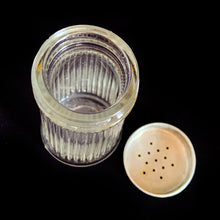 Load image into Gallery viewer, Vintage vertically ribbed clear depression glass shaker with metal lid. Use for salt, pepper or your favourite spice. Produced by the Dominion Glass Company, Canada, circa 1950s.  In good vintage condition, embossed makers mark of a &#39;D&#39; inside a diamond on the bottom.  Measures 2 x 3 7/8 inches
