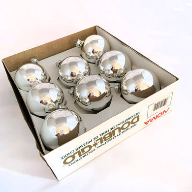 Boxed set of vintage silver glass ball Christmas ornaments. Produced by NOMA in Canada, circa 1990s.  In good vintage condition.  Measures 2