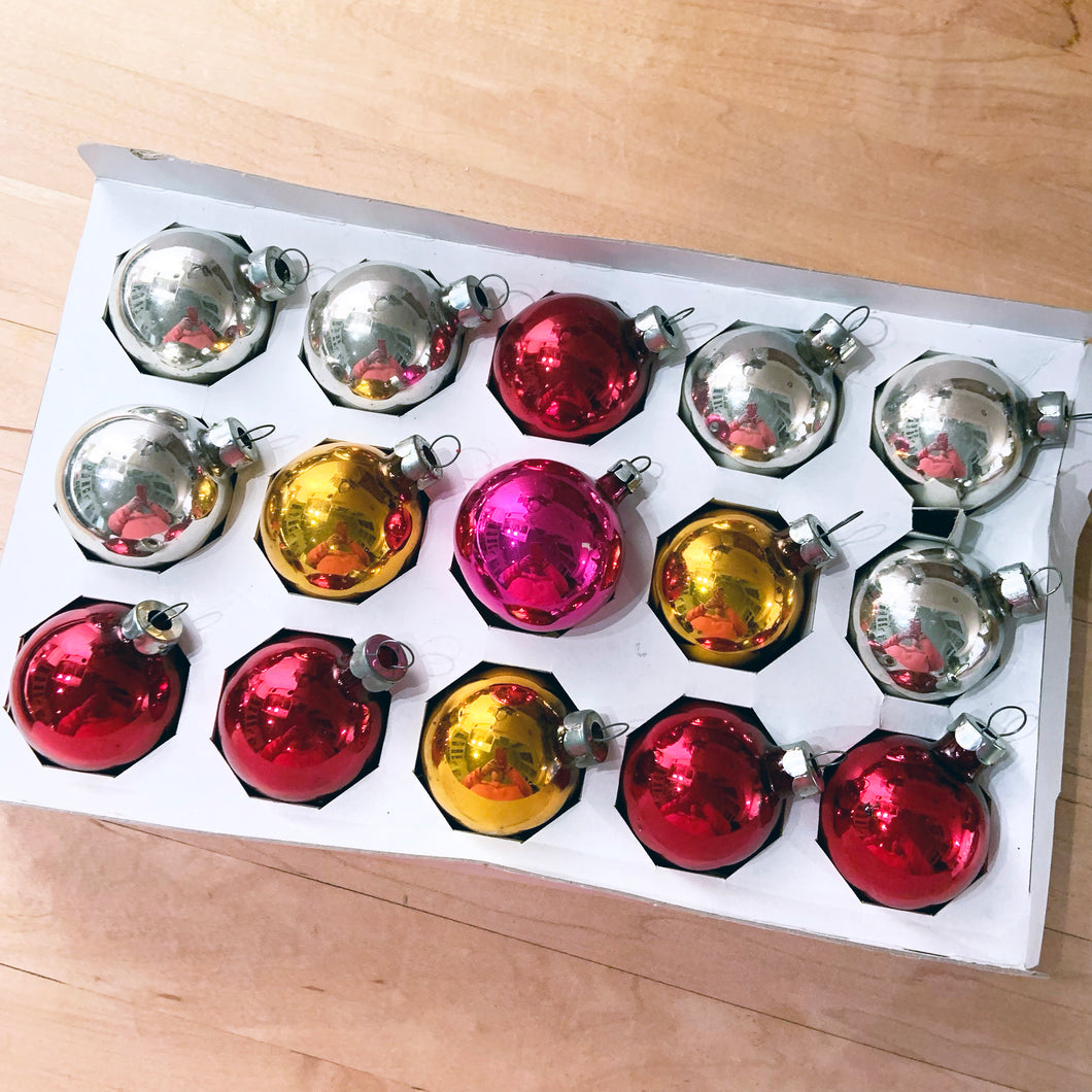 Fifteen beautiful silver, gold, red and pink glass ball Christmas ornaments in their original box. Perfect to amp up your holiday decor!  In excellent 1-1/2