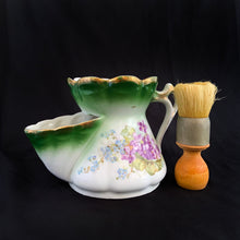 Load image into Gallery viewer, This vintage white porcelain shaving mug has an interesting artichoke embossed pattern with orange and blue strawflowers. Wood with metal collar shaving brush.  Unmarked. Germany  In excellent condition, no chips/cracks/repairs.  Dimensions: 5-1/4&quot; x 4-1/4&quot;
