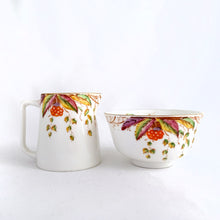Load image into Gallery viewer, RARE antique/vintage art deco style bone china creamer pitcher and open sugar bowl in the &quot;Virginia&quot; pattern depicting a colourful Virginia Creeper vine in shades of green, pink, purple, orange and yellow with gold trim. Produced by Royal Albert, England, circa 1927 - 1935 according to the maker&#39;s mark.   In excellent condition, no chips or cracks.  Creamer measures 4&quot; x 3-1/2&quot;  Sugar measures 3-7/8&quot; x 2-1/4&quot;
