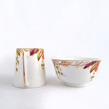 Load image into Gallery viewer, RARE antique/vintage art deco style bone china creamer pitcher and open sugar bowl in the &quot;Virginia&quot; pattern depicting a colourful Virginia Creeper vine in shades of green, pink, purple, orange and yellow with gold trim. Produced by Royal Albert, England, circa 1927 - 1935. A beautiful complement to your tableware!   In excellent condition, free from chips or cracks.  Creamer measures 4 x 3 1/2 inches  Sugar measures 3 7/8 x 2 1/4 inches
