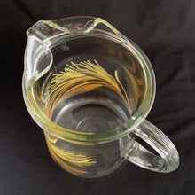 Load image into Gallery viewer, Large vintage ice lip pitcher with &quot;Wheat&quot; in yellow and orange decal. Produced by the Libbey Glass Company, circa 1973.  In excellent condition, no chips or cracks, minor flea bite on the ice lip.  Measures 5 3/4 x 9 1/2 inches
