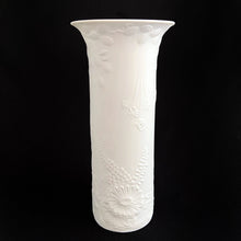 Load image into Gallery viewer, A delicate and elegant art nouveau style white bisque vase depicting a peacock and dragonfly with florals. Glazed on the inside. Designed by Manfred Frey on mold #467 for Kaiser. Made in Germany.  In excellent condition, no chips, cracks, staining or crazing.  Measures 9&quot;
