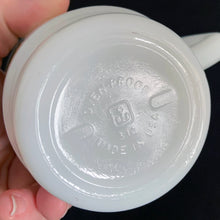 Load image into Gallery viewer, Vintage milk glass mug with vibrant gold atomic cloud or flower and graphic key at the rim. Produced by Anchor Hocking Glass Co. Circa 1970.  In excellent condition free from chips/cracks/wear.  Measures 3 x 3 3/8 inches  Capacity 8 ounces 
