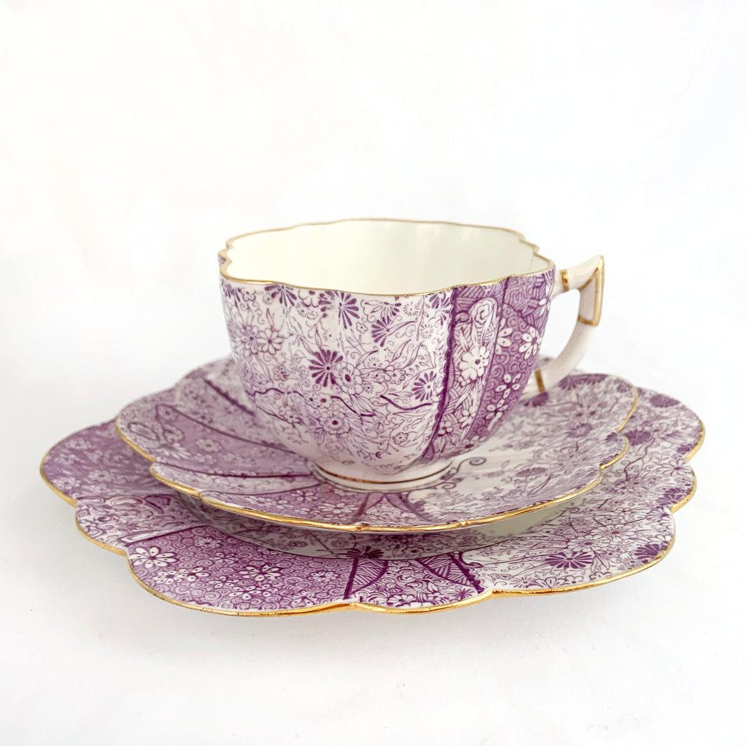 beautiful rare antique daisy-shaped bone china, tea cup, saucer, salad plate trio in complex purple floral 