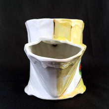 Load image into Gallery viewer, This vintage white porcelain shaving scuttle mug is hand painted with windmill and barn scene inside a gold triangle surrounded with yellow. The mug has raised art nouveau details. Use as intended or repurpose as a toothbrush or make-up brush holder.  Marked &quot;Made in Germany&quot; with an embossed multi-pointed sun.  In excellent condition, no chips/cracks/repairs. Some wear to the gold.  Measures 4 3/4 x 3 3/4 inches

