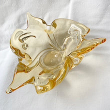 Load image into Gallery viewer, A stunning 3 point trillium shaped yellow art glass ashtray or bowl. This is a beautifully hand blown glass ashtray with lots of twists and turns of the glass. Makes a beautiful addition to home decor. Use as trinket dish, catchall, candy dish or as originally intended. Made by Lorraine Glass in Canada, circa 1970. It is absolutely spectacular piece of art glass!  In excellent condition, no chips or cracks and the bottom is polished smooth.  Measures 9&quot; x 3-7/8&quot;
