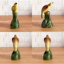 Load image into Gallery viewer, Pretty set of hand painted vintage ceramic yellow birds perched on green branches. I believe this is a Laysan or Hawaiian Finch. Marked with an &#39;R&#39; on the bottom.  Excellent condition, no chips or cracks.  Bird A: 4&quot; x 1.75&quot; x 4&quot;  Bird B: 2.5&quot; x 2&quot; x 5&quot;  Bird C: 2.5&quot; x 2&quot; x 5&quot;
