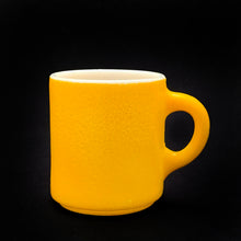 Load image into Gallery viewer, Vintage orange peel texture milk glass C handle mug in sunshine yellow! Produced by Hazel-Atlas Glass, circa 1960s.  In excellent condition, free from chips/cracks.  Measures 3&quot; x 3-1/4&quot;
