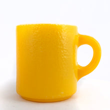 Load image into Gallery viewer, Vintage orange peel texture milk glass C handle mug in sunshine yellow! Produced by Hazel-Atlas Glass, circa 1960s.  In excellent condition, free from chips/cracks.  Measures 3&quot; x 3-1/4&quot;
