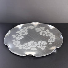 Load image into Gallery viewer, Vintage mid-century round aluminum tray in the &quot;Roses&quot; pattern. A great serving tray and a perfect addition to mid-century barware.  In good vintage condition, some scratches.  Measures 16 x 1/2 inches
