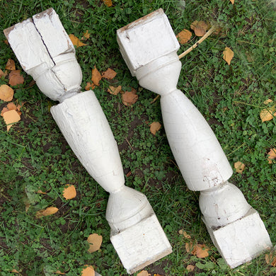 A pair of salvaged vintage balusters with original chippy white paint. Great addition to shabby chic decor. Great pieces to repurpose as props, candle stands or turn them into one-of-a-kind lamps.  In vintage weathered condition.  Measures 4 x 4 x 21 inches. Jacks Daughter of All Trades Vintage Antique Store Shop Reseller Etsy Shopify Toronto Canada Free Porch Pick Up Local Delivery Worldwide Shipping Unique Sustainable Gift Home Decor Collectible Collector Farmhouse Cottage Core Architectural Salvage