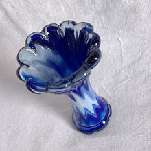 Load image into Gallery viewer, This gorgeous vintage cased glass vase encapsulates blue and white glass in a clear overcoat. The swirl pattern is beautiful, the colours are rich and the trumpet shape reveals a scalloped flower edge. A unique, one-of-a-kind piece.  In excellent condition, no chips or cracks.  Measures 4 x 5 1/2 inches
