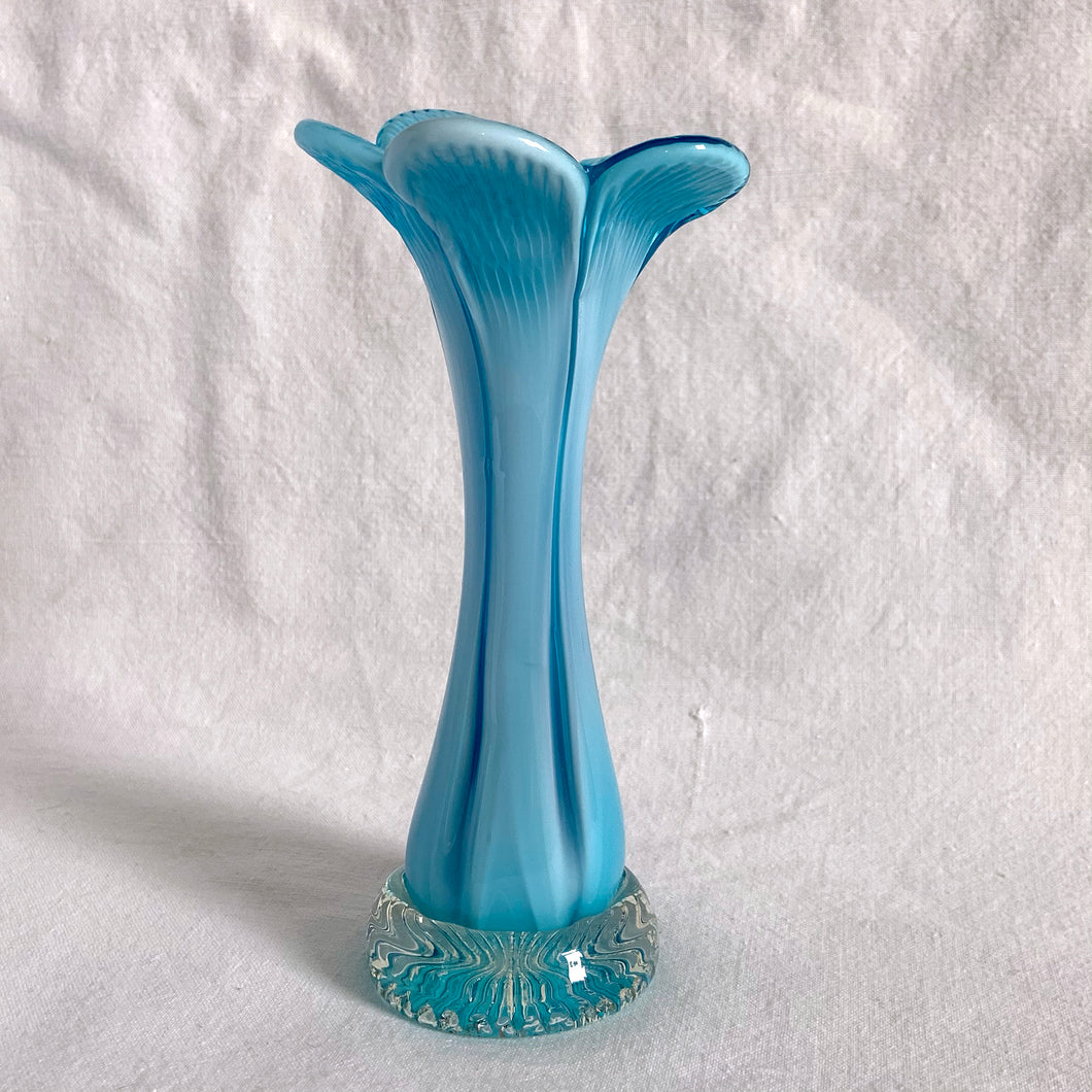 A beautiful hand blown trumpet-shaped art glass vase in light blue encase in clear glass with applied clear base with pressed starburst. A lovely flower trumpet vase for a lovely floral bouquet.  In excellent condition, no chips or cracks.  Measures 3 3/4 x 7 3/4 inches