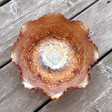 Load image into Gallery viewer, Lovely vintage &quot;Two Flowers&quot; iridescent marigold carnival glass bowl featuring Dogwood and Marsh Lily flowers with fluted edge on three spatulate feet. Crafted by Fenton Art Glass, USA, circa 1920s. A sweet piece for any Fenton collector!  In excellent condition, free from chips.  Measures 7 5/8 x 3 3/4 inches
