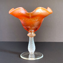 Load image into Gallery viewer, Antique &quot;Sailboat&quot; marigold carnival glass footed pedestal compote featuring a shimmery iridescent orange ruffle-edged bowl embossed with sailboats with a twisted spiral stem. Crafted by Fenton Art Glass, USA, 1907–1925. A beautiful piece to add to your art glass collection! In excellent condition, free from chips. Measures 6 x 6 inches
