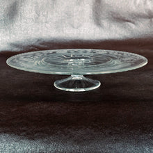 Load image into Gallery viewer, A stunning vintage clear glass cake pedestal cut by WJ Hughes in his famous twelve petalled Corn Flower pattern with leaf sprays and beaded edge. Glass blank produced by the Viking Glass Company. Perfect for serving cake and desserts.  In excellent condition. No chips or cracks.  Size: 11&quot; x 2.5&quot;

