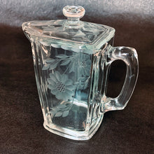 Load image into Gallery viewer, Vintage WJ Hughes lidded syrup pitcher cut in the 12-petal &quot;Corn Flower&quot; pattern with leaf sprays. Glass blank produced by Paden City Glass Co., USA, circa 1930. This elegant piece would make an excellent wedding shower or housewarming gift.  In excellent condition, free from chips/cracks. Each lid has chipping, see photos for details.  Measures 5 1/4 inches tall
