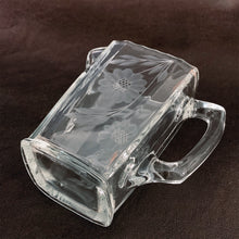 Load image into Gallery viewer, Vintage WJ Hughes lidded syrup pitcher cut in the 12-petal &quot;Corn Flower&quot; pattern with leaf sprays. Glass blank produced by Paden City Glass Co., circa 1930. This elegant piece would make an excellent wedding shower or housewarming gift.  We have 2 pitchers. Both are in excellent condition, free from chips/cracks. Each lid has chipping....see photos for details.  Measures 5-1/4&quot; tall
