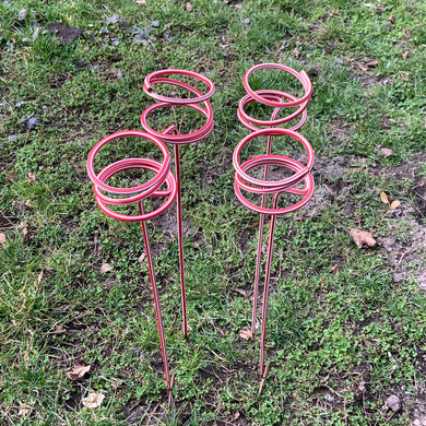 Authentic vintage straight from grandma's house! Check out these sets of super groovy mid-century drink holders. They are perfect for picnics, parties, concerts, fireworks viewing and camping! These metal spiral lawn stakes hold cups, cans or bottles of your favorite beverage. Just stick them in the ground, and you're good to go!  In good used vintage condition. Cleaned and ready to use. End of each spiral is now finished with a white rubber cap.  Measures 3 1/2 x 24 inches