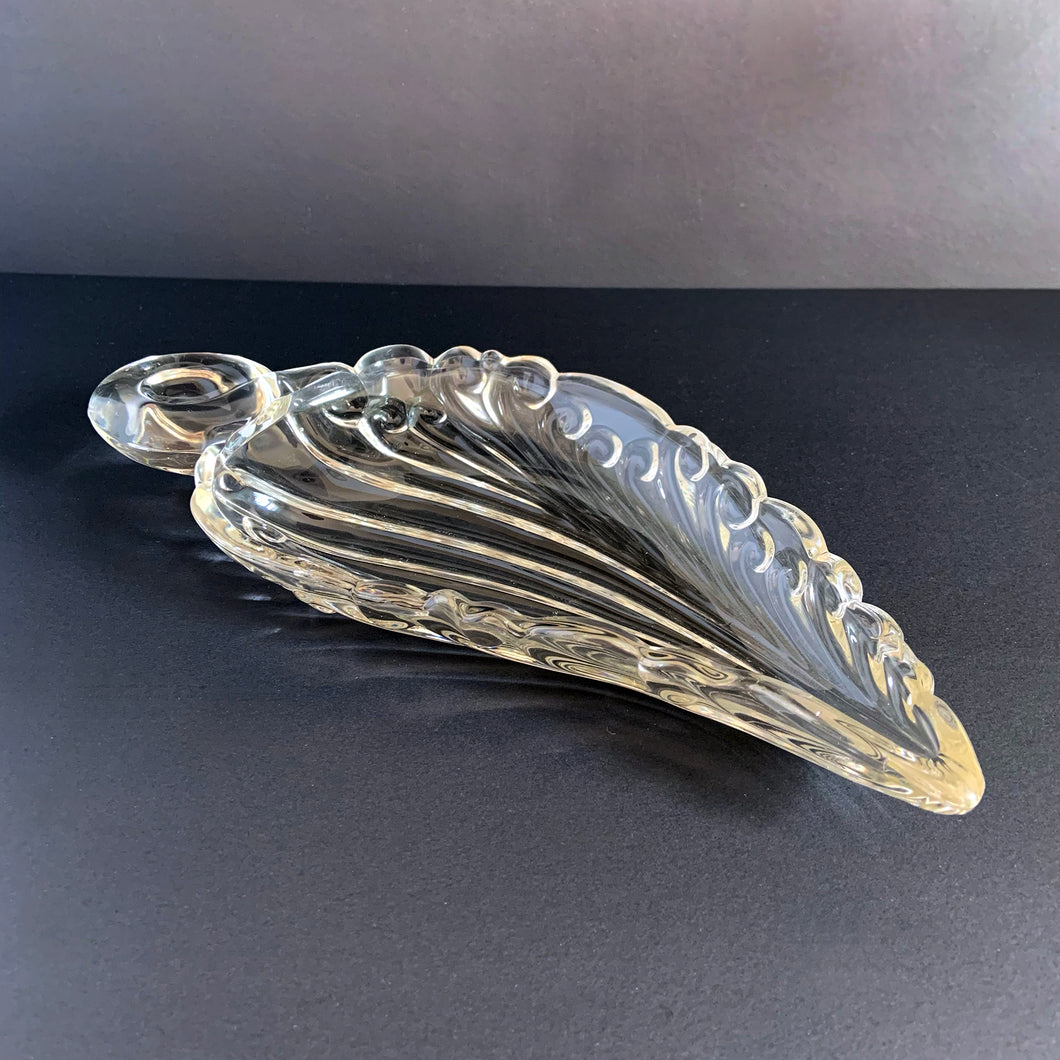 Loving the details of this elegant vintage swirled leaf-shaped heavy-weighted pressed glass dish. It's perfect as a relish, candy or trinket dish.  In excellent condition, no chips or cracks.  Measures 12 1/2 x 5 1/2 x 1 1/2 inches