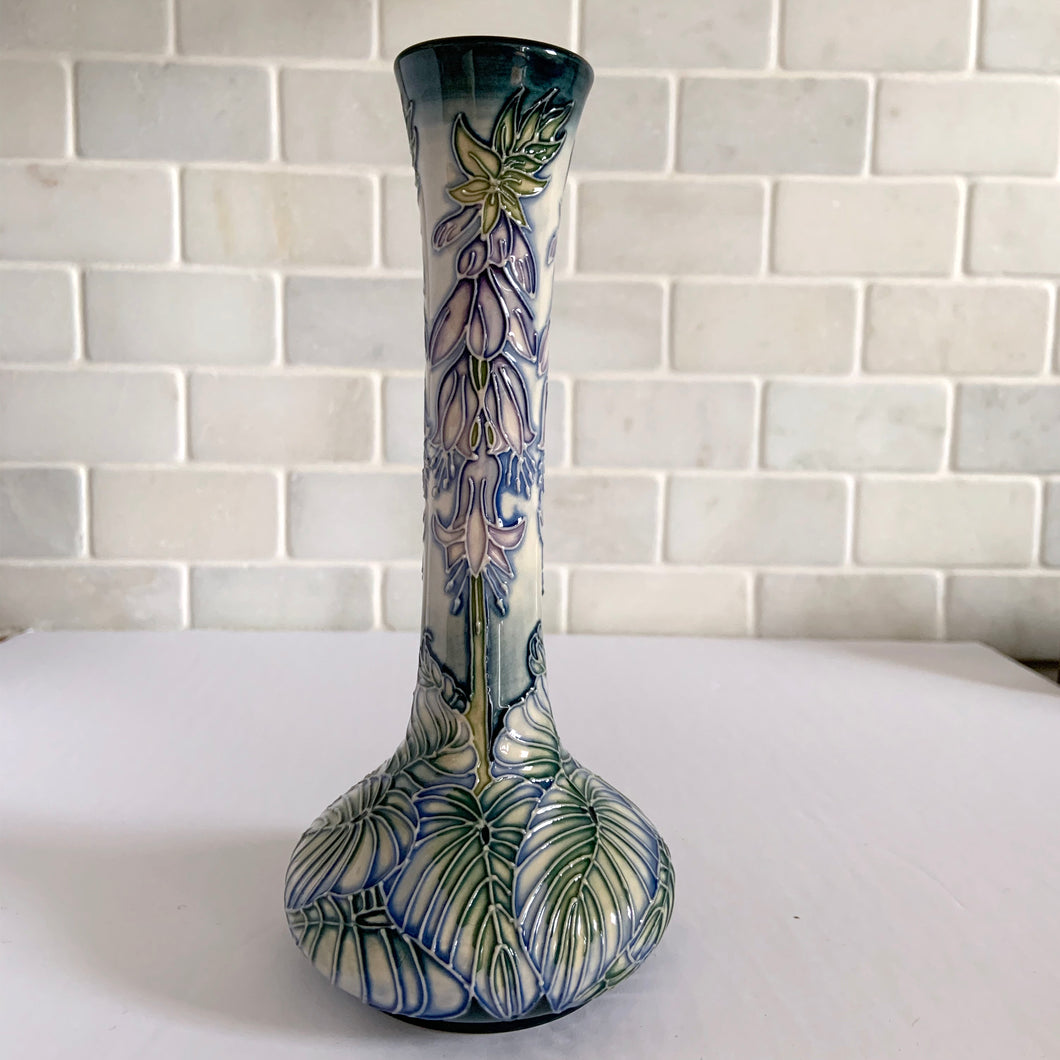 Vintage Sea Drift vase in shape 99/8. Designed by Rachel Bishop in 2002. Numbered edition, 202. This is an absolutely stunning piece, hand painted over slip glaze on a dark blue ground with shades of blue, green purple and creamy white. Produced by Moorcroft Pottery, England. In excellent condition, no chips, cracks or repairs. Production marks on the bottom. In original box. Offered from our personal collection. Measures 3-1/2