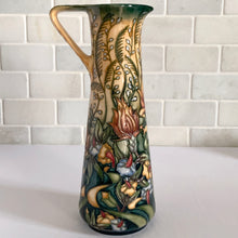 Load image into Gallery viewer, This beautiful &quot;Prairie Summer&quot; ewer pitcher or jug is reminiscent of a summer&#39;s day. Designed by Rachel Bishop in 2001 and hand painted over slip glaze on a yellow ground with shades of red, blue, yellow and white on shape JU3. Produced by Moorcroft Pottery, England.  In excellent condition, no chips, cracks or repairs. In original box. Purchased directly from the Moorcroft Pottery shop in Stoke-on-Trent, England. Offer from our private collection.  Measures 9-1/2&quot;
