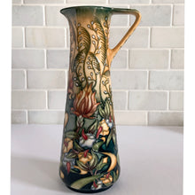 Load image into Gallery viewer, This beautiful &quot;Prairie Summer&quot; ewer pitcher or jug is reminiscent of a summer&#39;s day. Designed by Rachel Bishop in 2001 and hand painted over slip glaze on a yellow ground with shades of red, blue, yellow and white on shape JU3. Produced by Moorcroft Pottery, England.  In excellent condition, no chips, cracks or repairs. In original box. Purchased directly from the Moorcroft Pottery shop in Stoke-on-Trent, England. Offer from our private collection.  Measures 9-1/2&quot;
