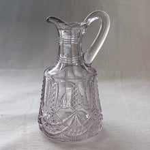 Load image into Gallery viewer, This lovely little glass vinegar cruet. Crafted by Flint Glass, USA, circa early 19th century. The glass has a violet tinge due to the manganese content in the glass which when exposed to sunlight has a tendency to turn violet in colour. A pretty piece!  In excellent used condition. There is a tiny chip on the inside where the stopper was placed.  Approximately 5 inches tall   
