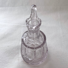Load image into Gallery viewer, This lovely little glass vinegar cruet. Crafted by Flint Glass, USA, circa early 19th century. The glass has a violet tinge due to the manganese content in the glass which when exposed to sunlight has a tendency to turn violet in colour. A pretty piece!  In excellent used condition. There is a tiny chip on the inside where the stopper was placed.  Approximately 5 inches tall   
